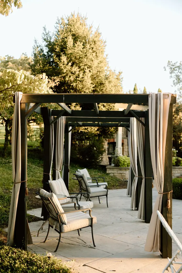 The pergola with its curtains drawn back