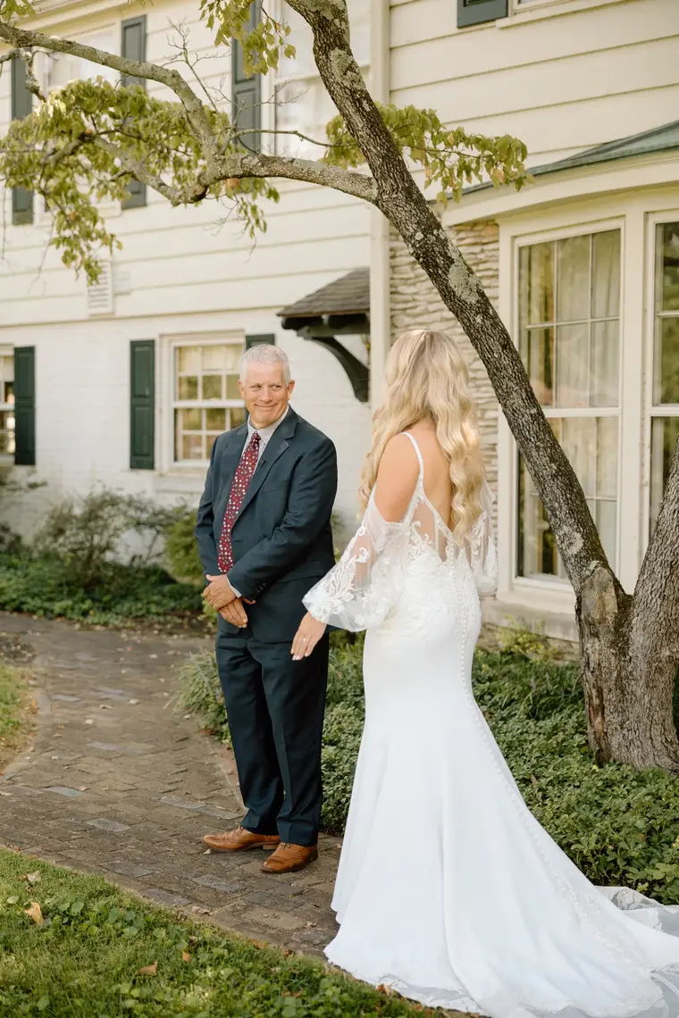 Her father opening his arms at the first look