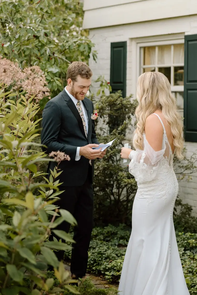 Reading her vows to him in the garden