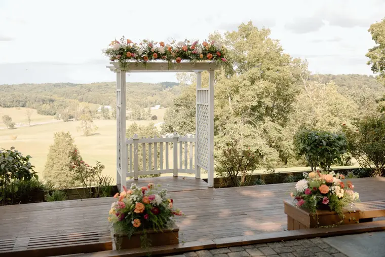 The ceremony arbor dressed above the valley