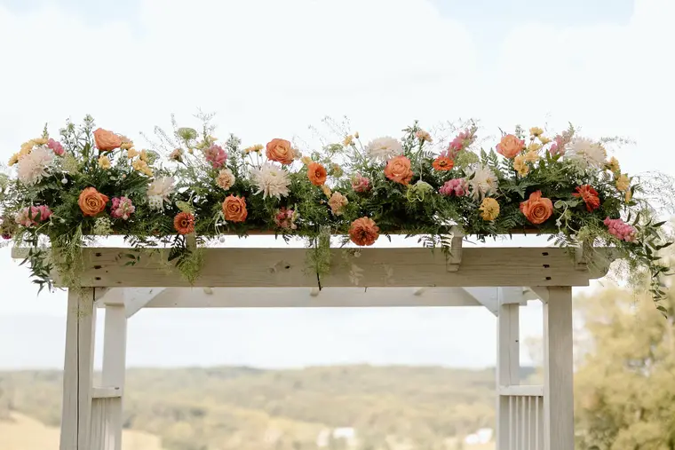 The arbor florals against the hills