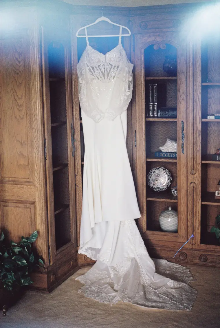The gown on the carved bookcase on film