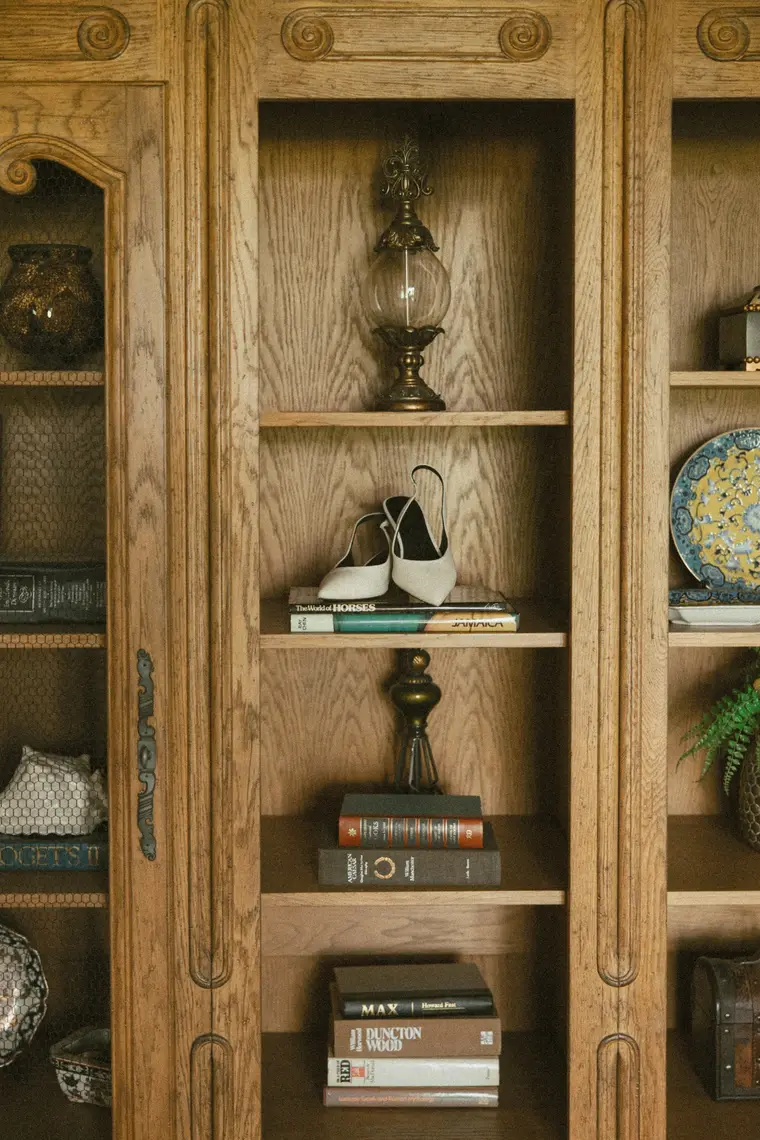 Her shoes on the bookcase shelf