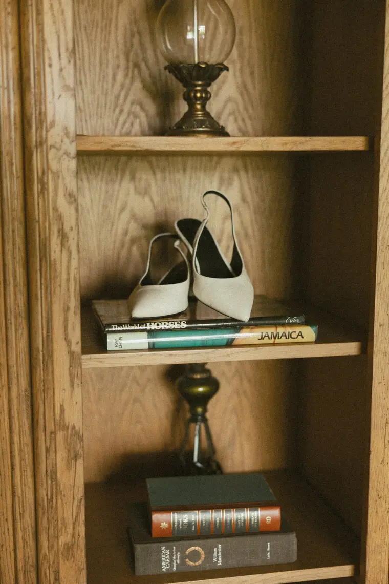 Her shoes among the books