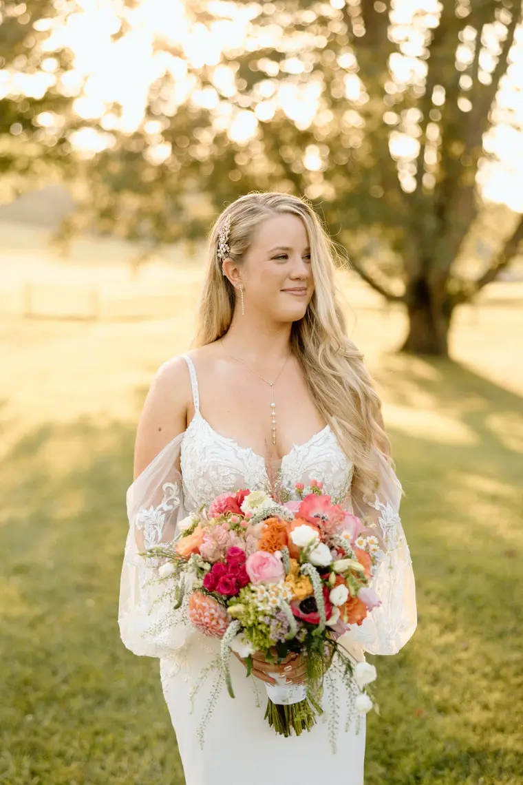 The bride backlit with her bouquet