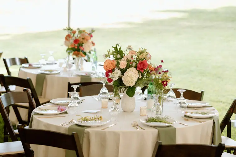 A reception table with its florals