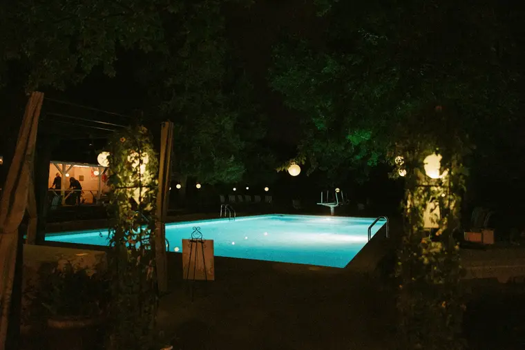The pool lit at night