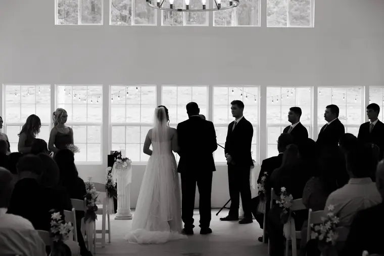 Black and white the ceremony from the back of the room