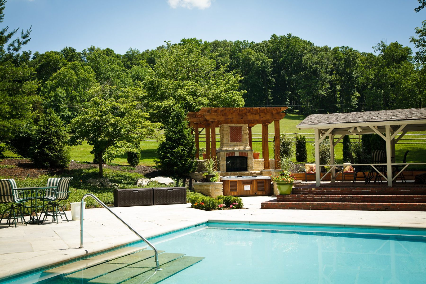 The Jr. Olympic pool with pergola and cabanas